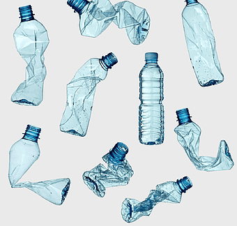 recycled plastic bottles, clear plastic waste, blue pet bottle recycling, water bottle litter, environmental conservation, sustainable waste management, eco-friendly disposal methods