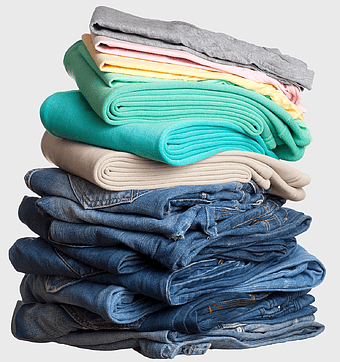 stacked casual clothes, folded denim jeans, assorted t-shirts, laundry pile, clothing organization, wardrobe essentials, textile storage solutions