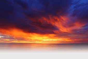 sunset over horizon, golden clouds, calm evening sky, afterglow atmosphere, vibrant sunset colors, serene dusk landscape, dramatic cloud formations