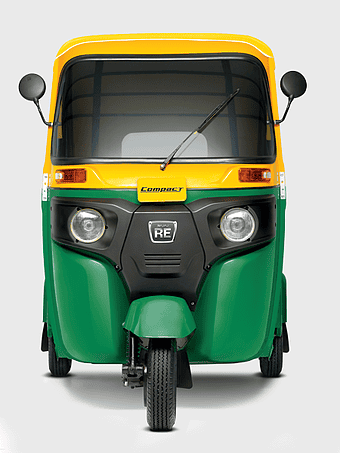 yellow-green Bajaj Compact auto rickshaw, Bajaj Auto three-wheeler, public transport vehicle, India auto rickshaw, compact transportation solution, urban mobility options, eco-friendly auto rickshaw